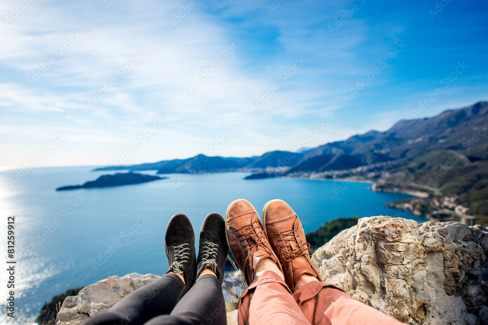 Couples legs on the mountain