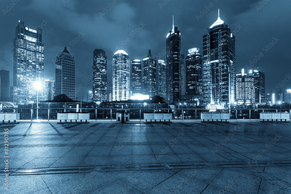 footpath and modern buildings at night