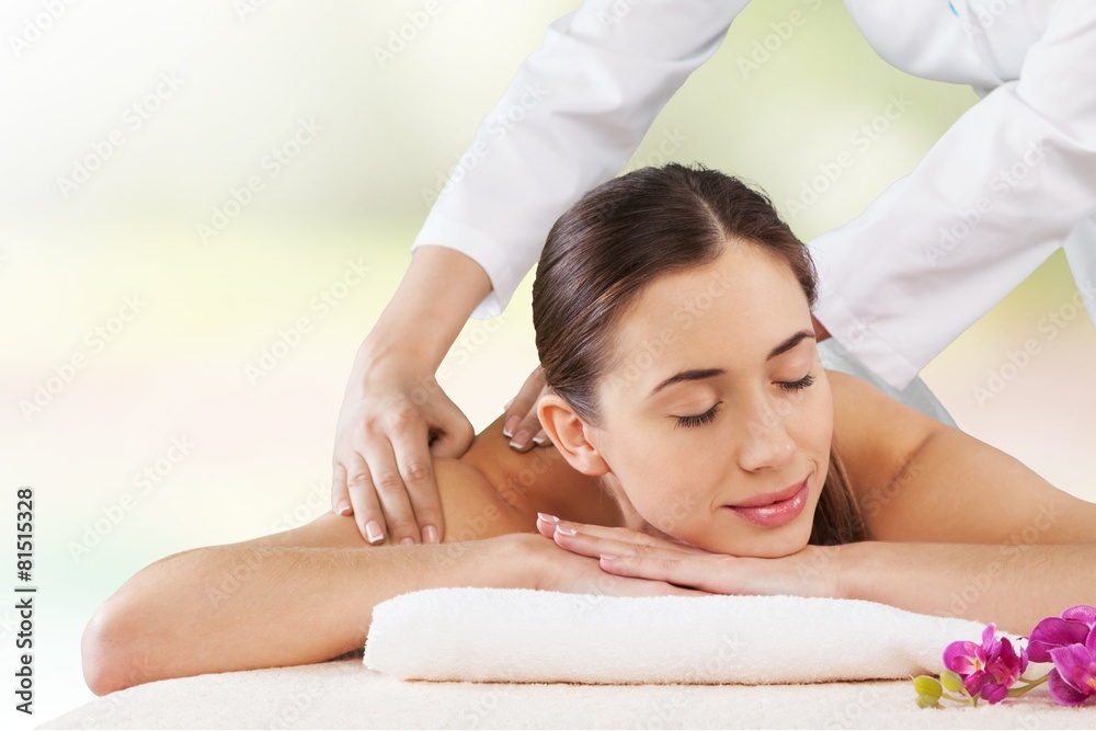 Adult. Young woman on spa massage of shoulder in the beauty