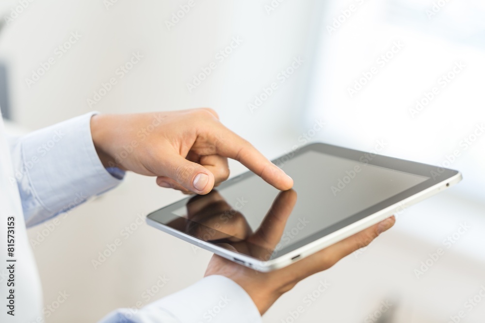 Tablet. Man holding digital tablet, closeup