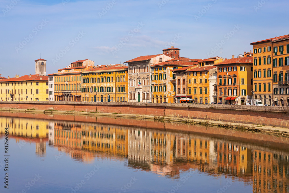 Old town of Pisa with reflection in Arno river, Italy