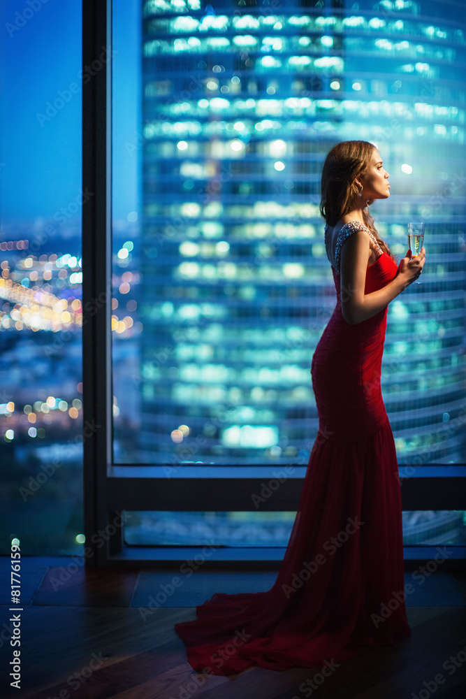 Beautiful young girl in a red dress