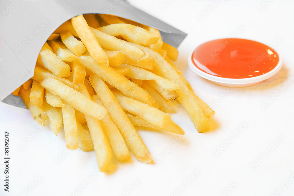 french fries in white box with chili sauce