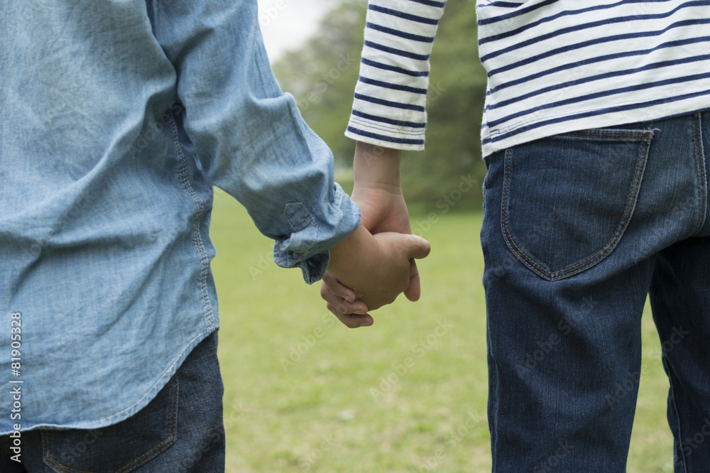 Children holding hands in the park