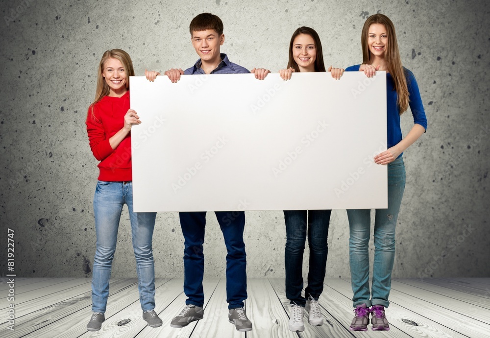 Sign. College Students Holding a Blank Sign