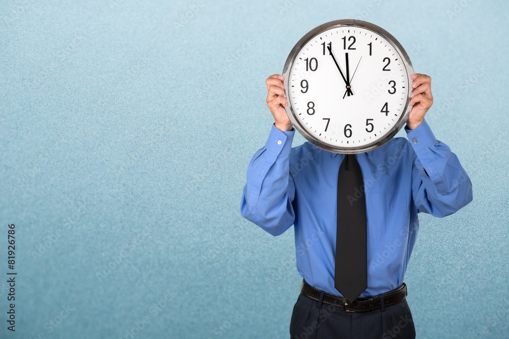 Clock. Businessman Holding Clock