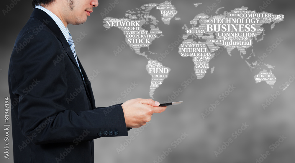 Businessman using tablet with word cloud, business globalization