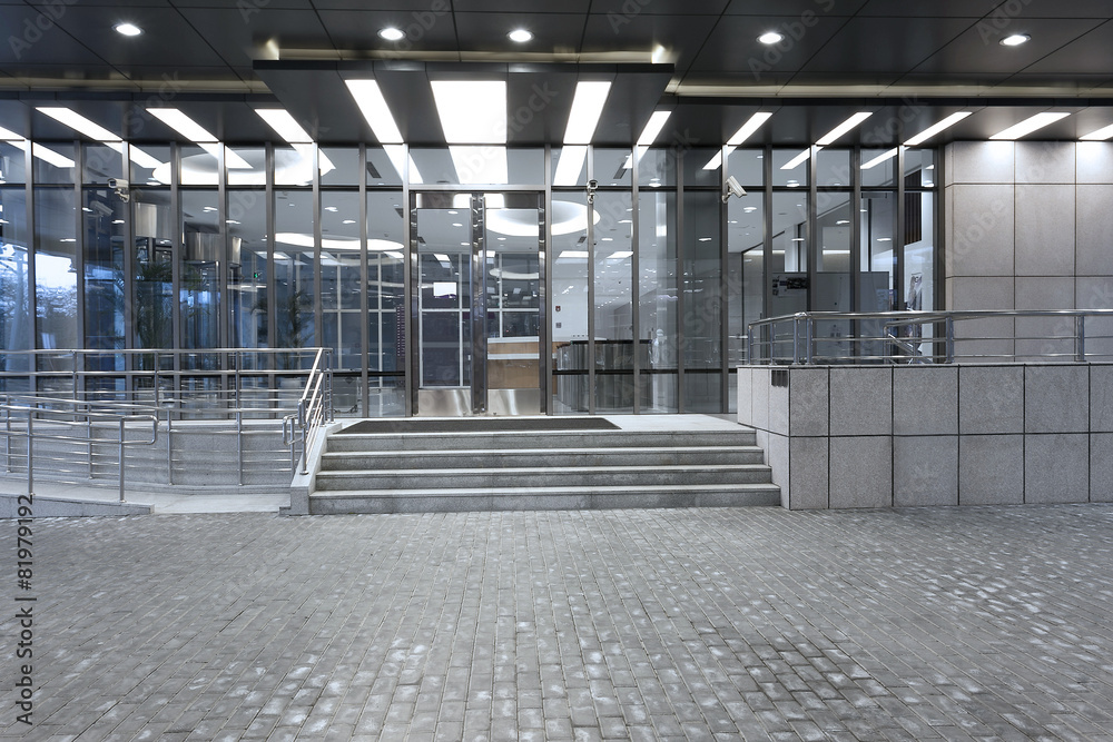 Empty road in front of modern building exterior