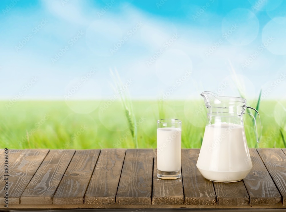 Milk. Milk and sunny spring field