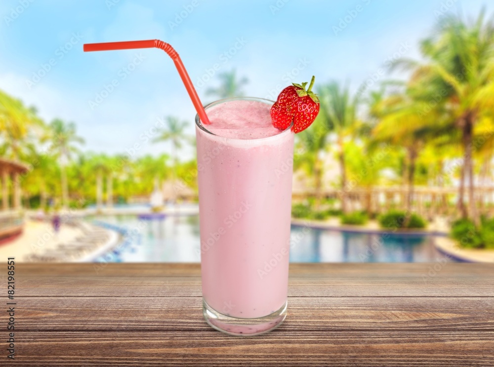 Milk. Glass of strawberry milkshake on white background