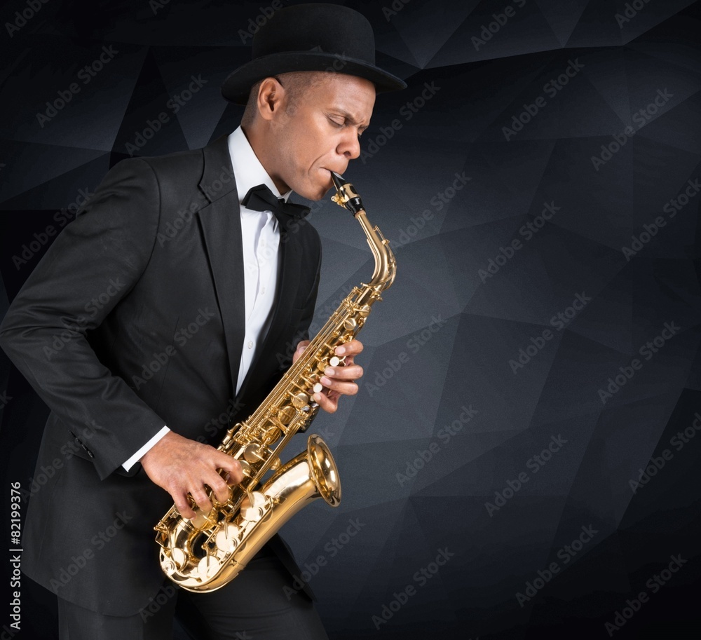 Sax. Black american jazz saxophone player. Vintage. Studio shot.