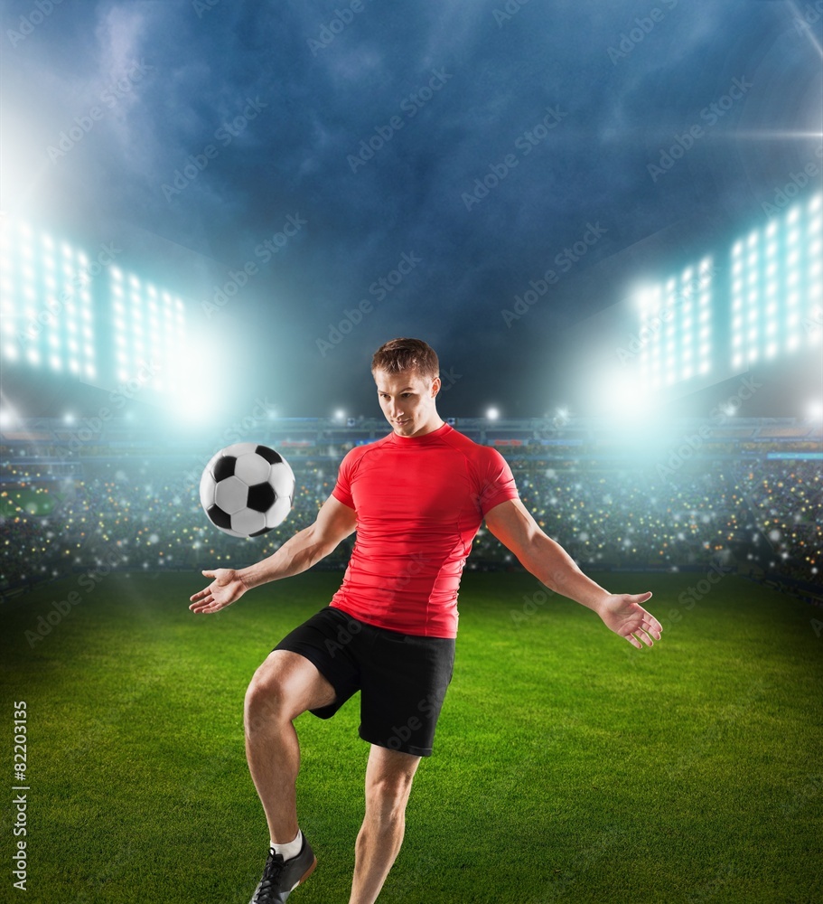 Soccer. One african man soccer player green jersey juggling in