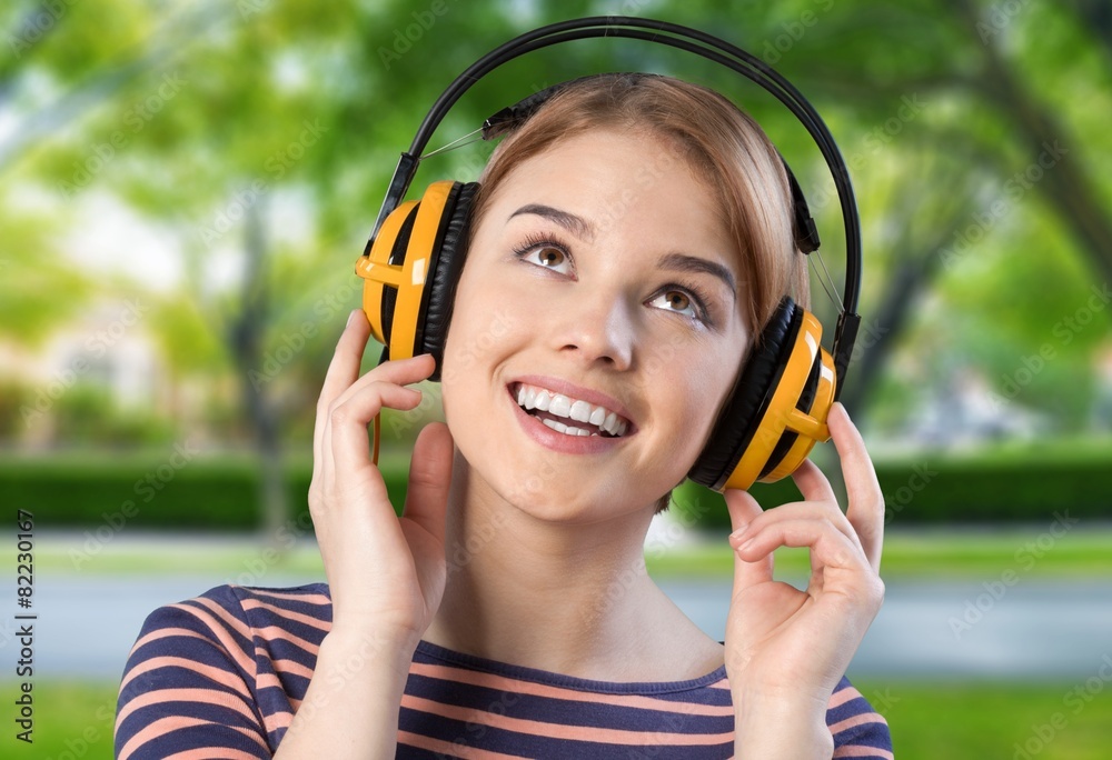 Music. Young woman listening to music