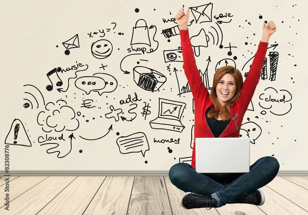 Women. Female student with a laptop cheering in success