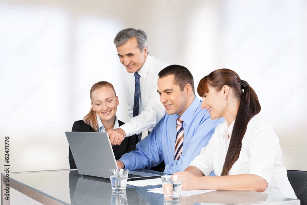 Business. Business people working on a laptop