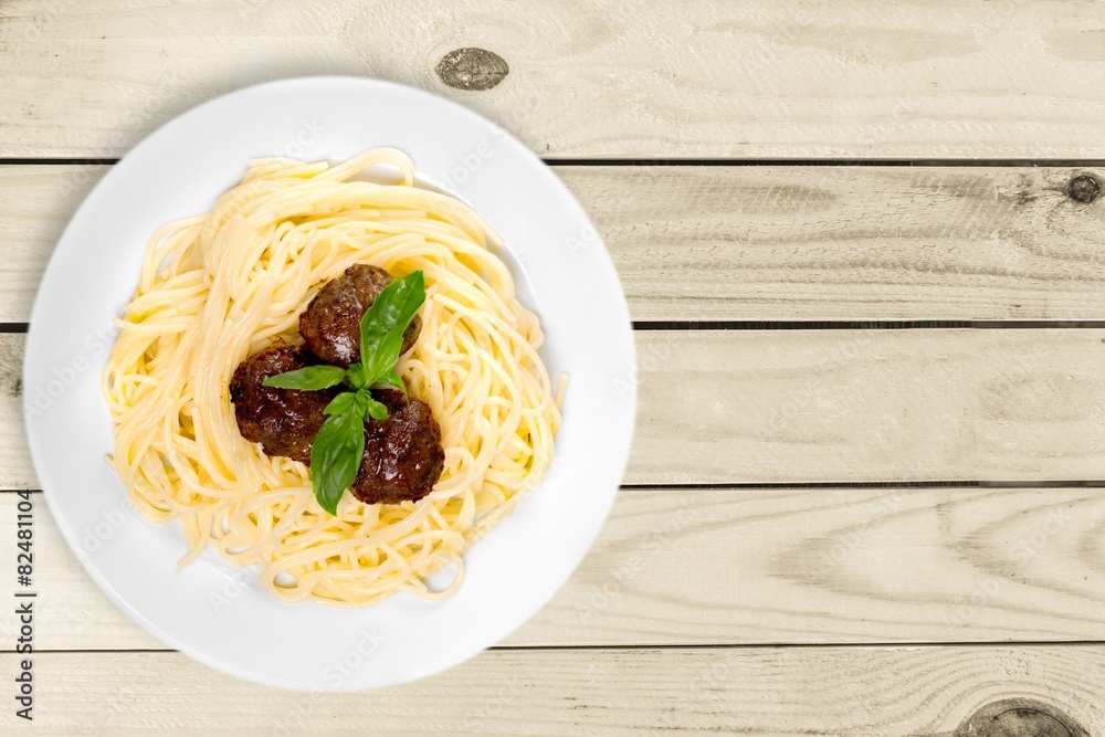 Background. Pasta with meatballs and parsley with tomato sauce