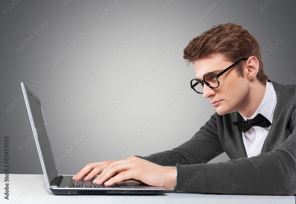 Idea. Young man working on laptop