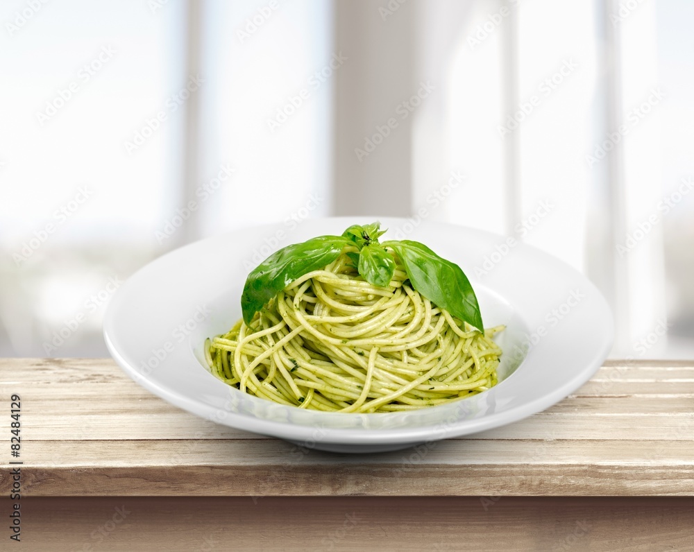 Pasta. Italian pasta spaghetti with pesto sauce and basil leaf