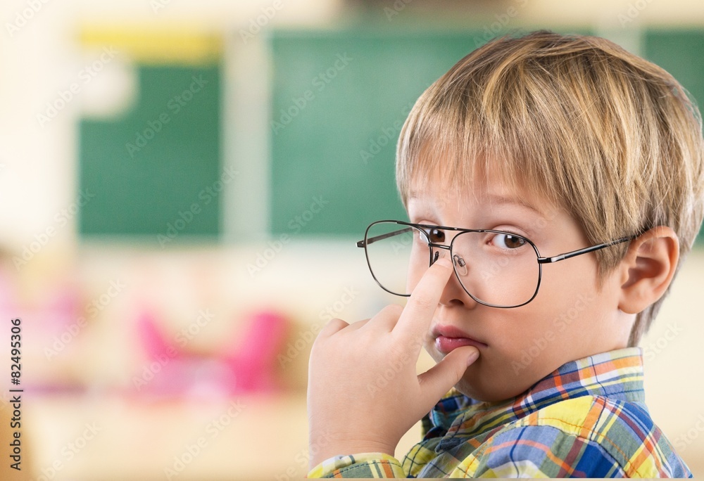 Chalkboard. Thoughtful boy funny portrait with abstract idea