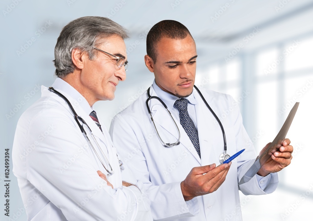 Doctor. Serious doctor with touchpad.