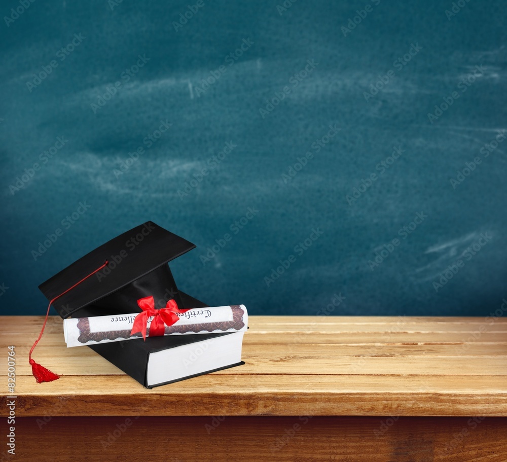 Graduation. Diploma and graduation cap