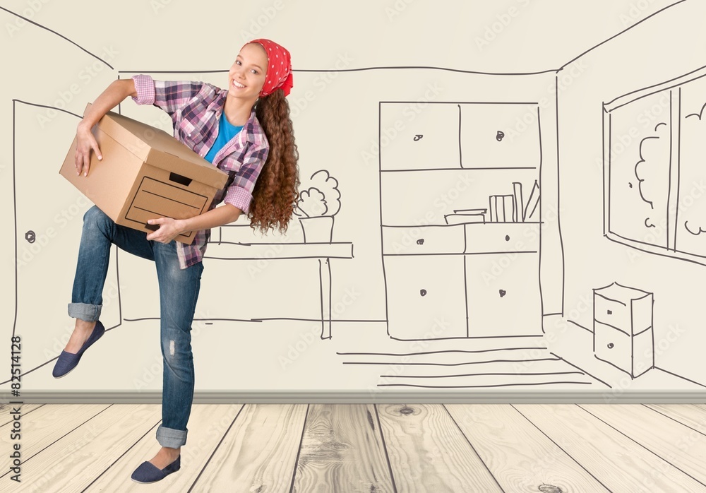 Moving House. Young Woman Lifting Box