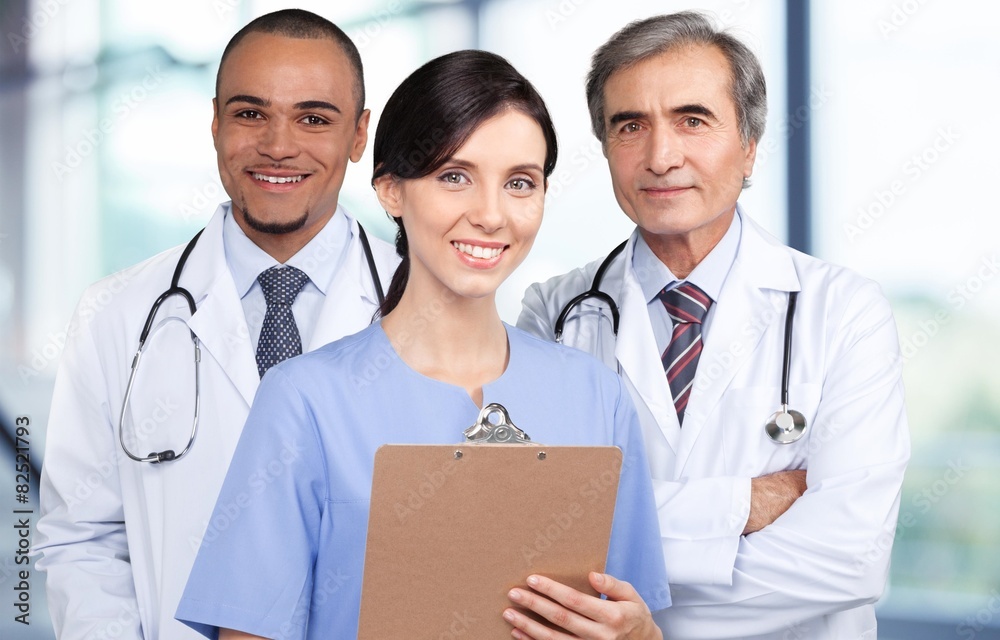 Doctor. Portrait of successful doctors standing together and