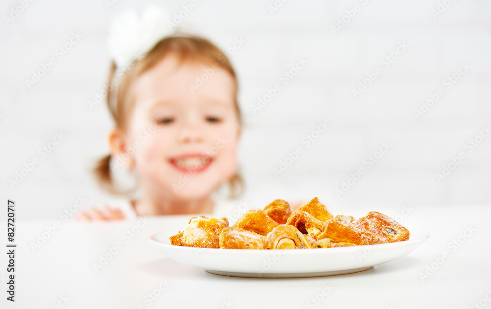 happy child  girl eats biscuits, cookie