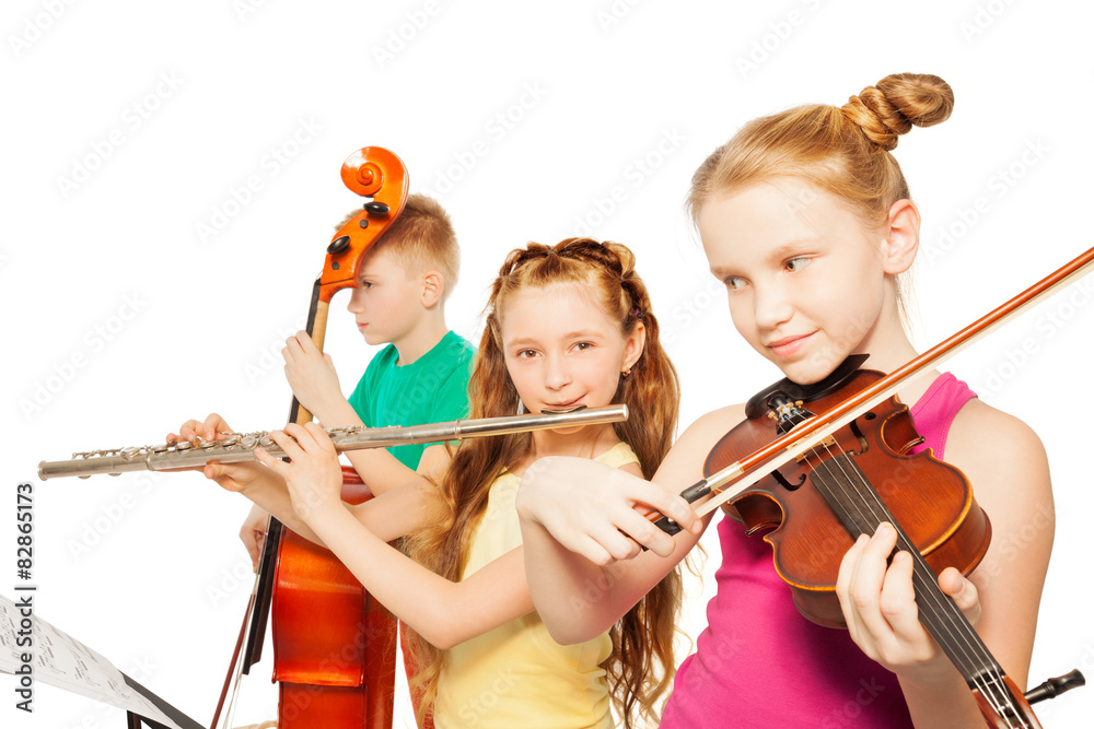 Close-up view of kids playing musical instruments