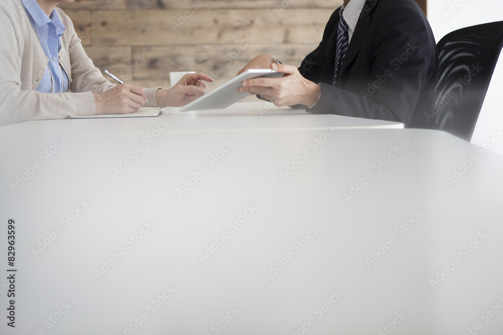 Men are showing electronic tablet