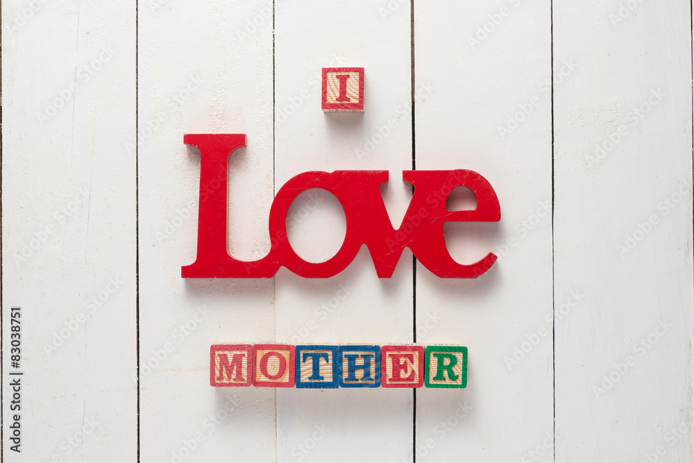 Happy mothers day concept - I love mother sign over white wood background