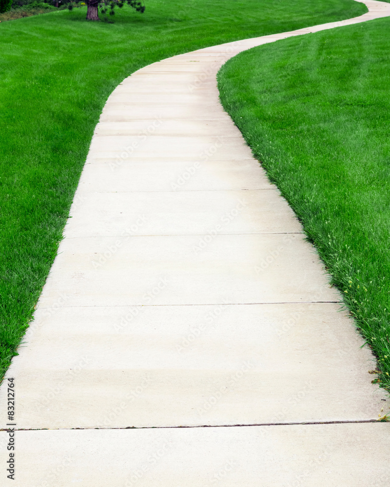 Pathway through green lawn