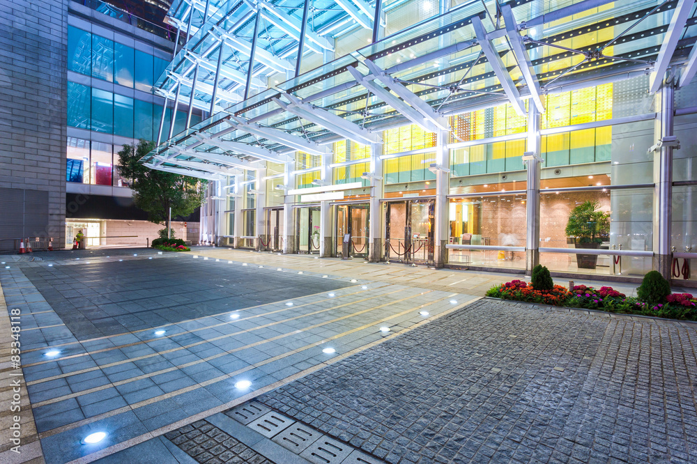 Empty floor near modern building facade