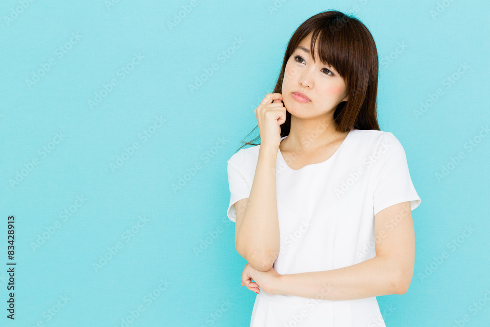 attractive asian nurse on blue background