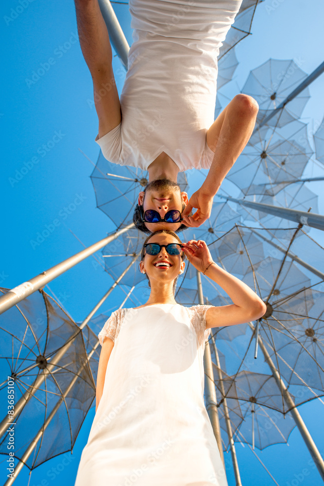 Portrait of Couple on the abstract background with umbrellas