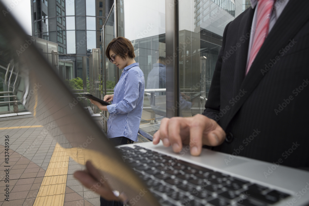 Men open the PC in the business district