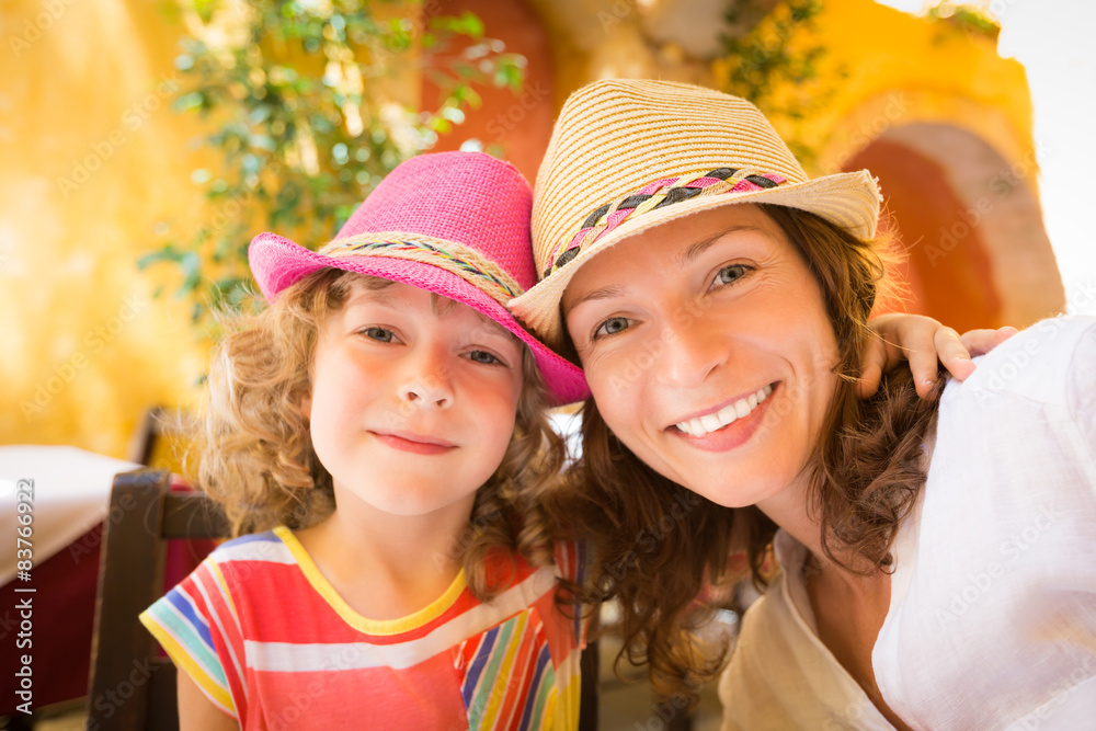 Mother and child in summer cafe