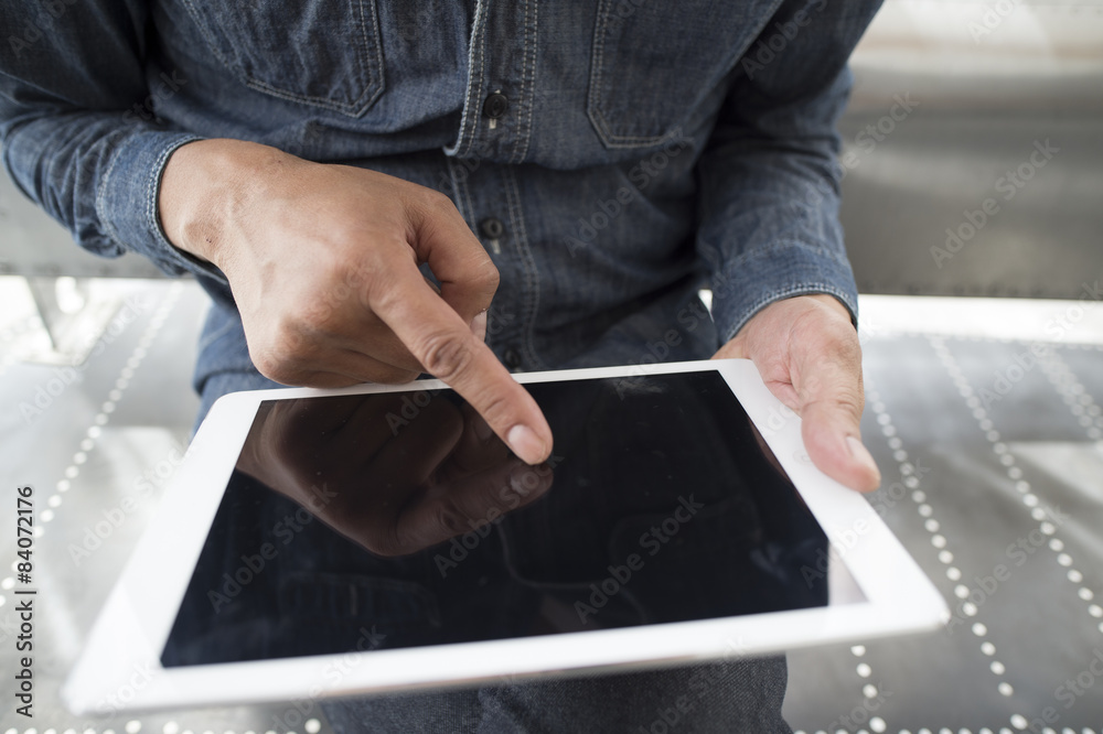 Men are using the electronic tablet sitting