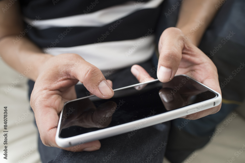 Men are sending the e-mail sitting on the sofa