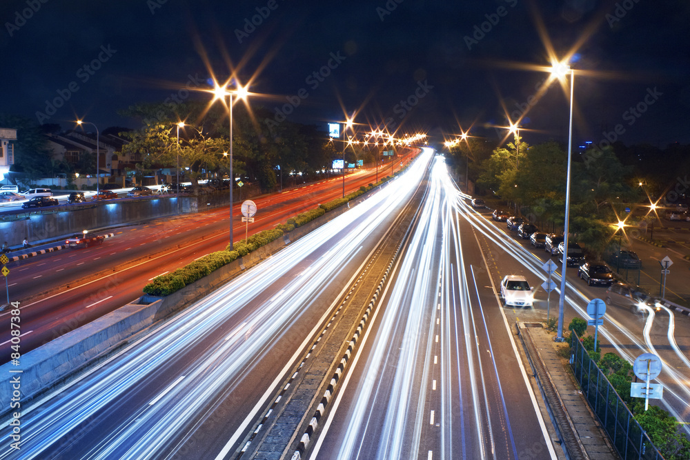 Long exposure photo of traffic with blurred traces from cars