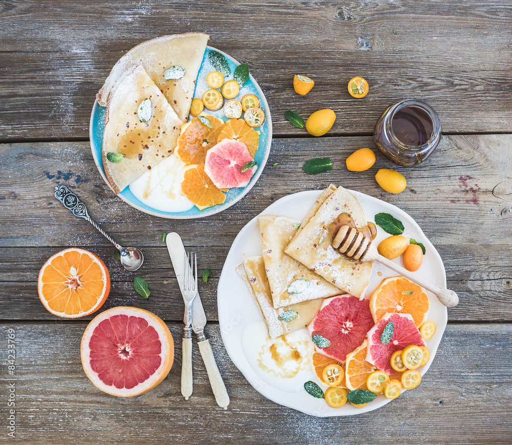 Spring vitamin breakfast set. Thin crepes or pancakes with fresh