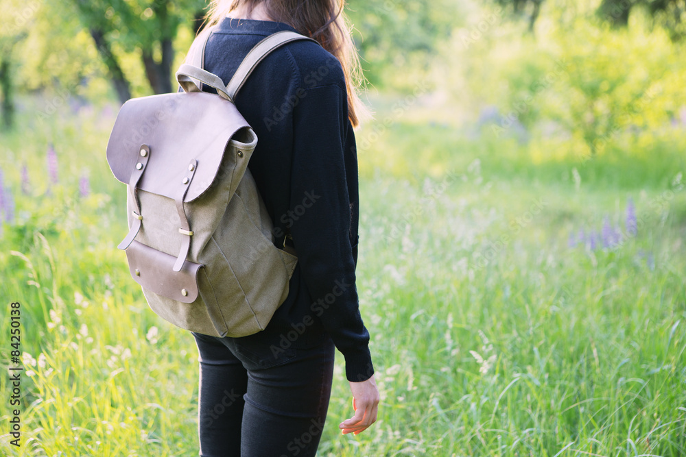 Young woman hiking with backpack