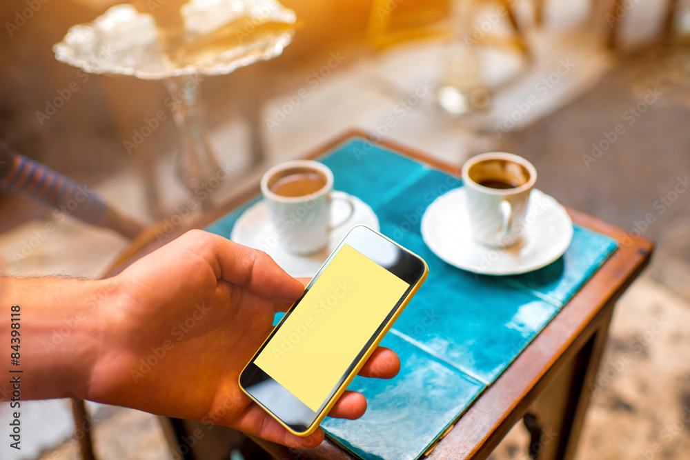 Using smartphone in the turkish cafe