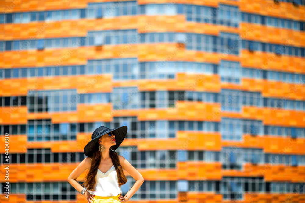 Woman on the contemporary facade background