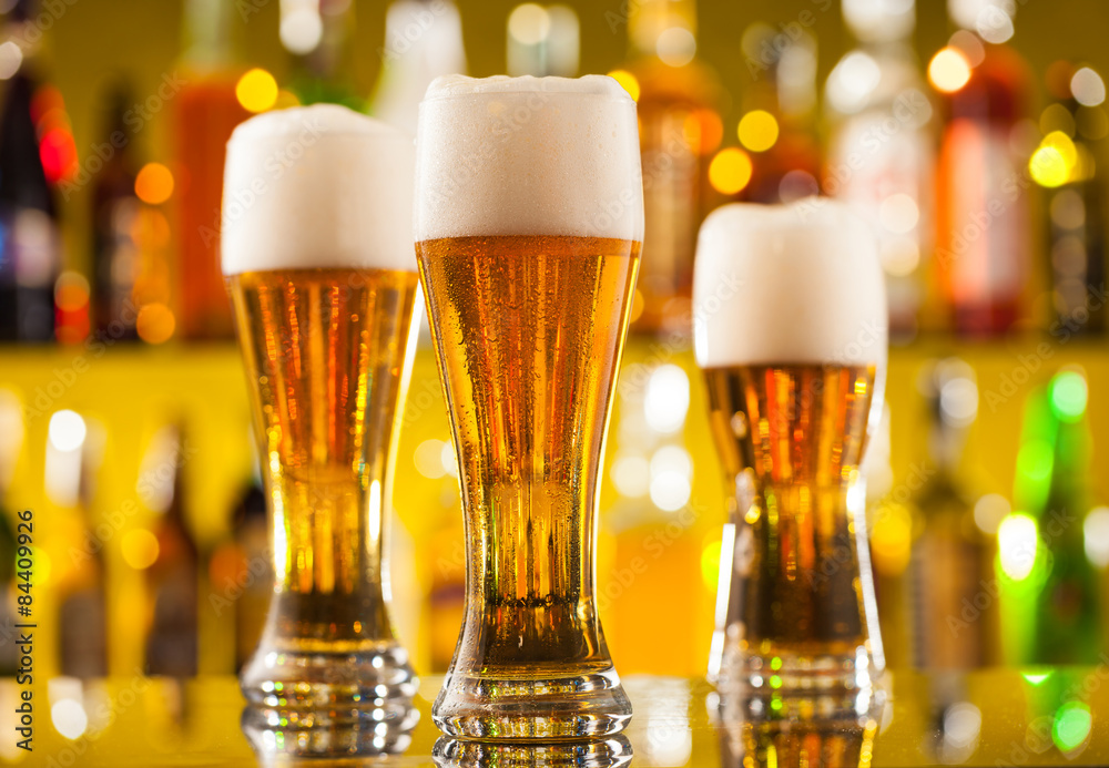 Jugs of beer served on bar counter