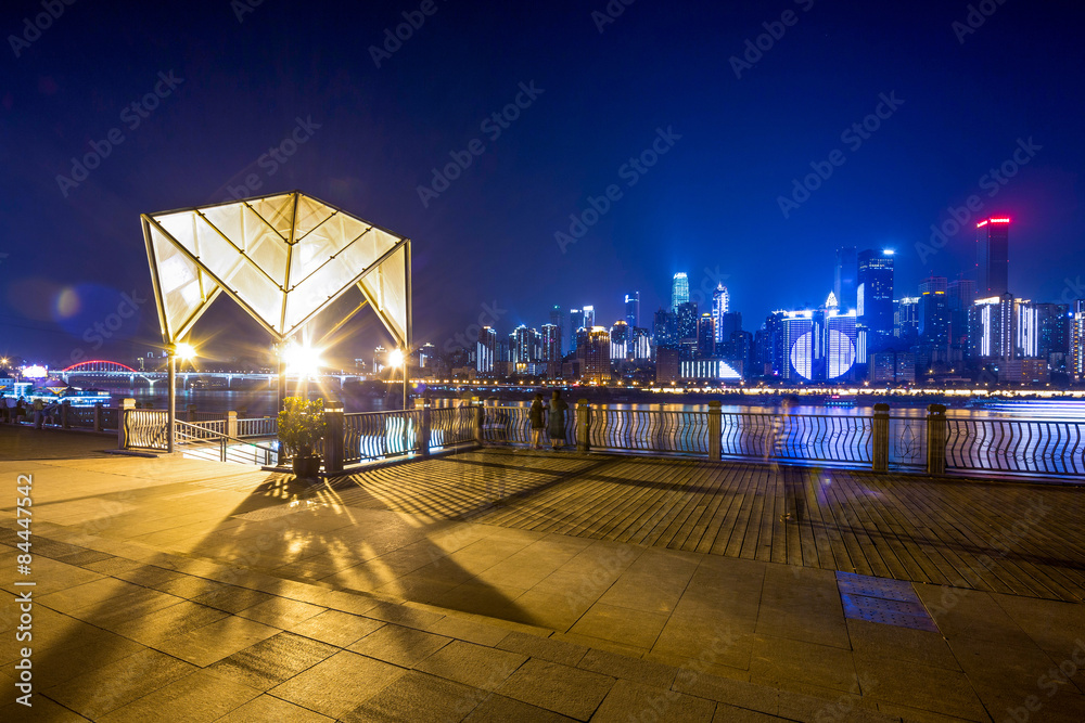 Empty floor and illuminated skyscraper