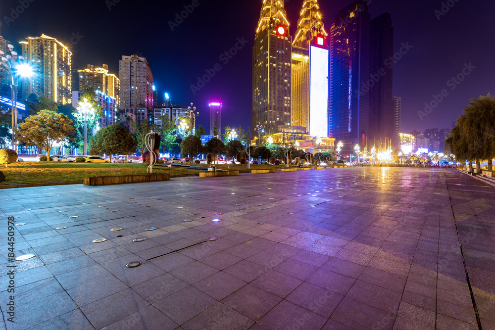 Empty floor and illuminated skyscraper