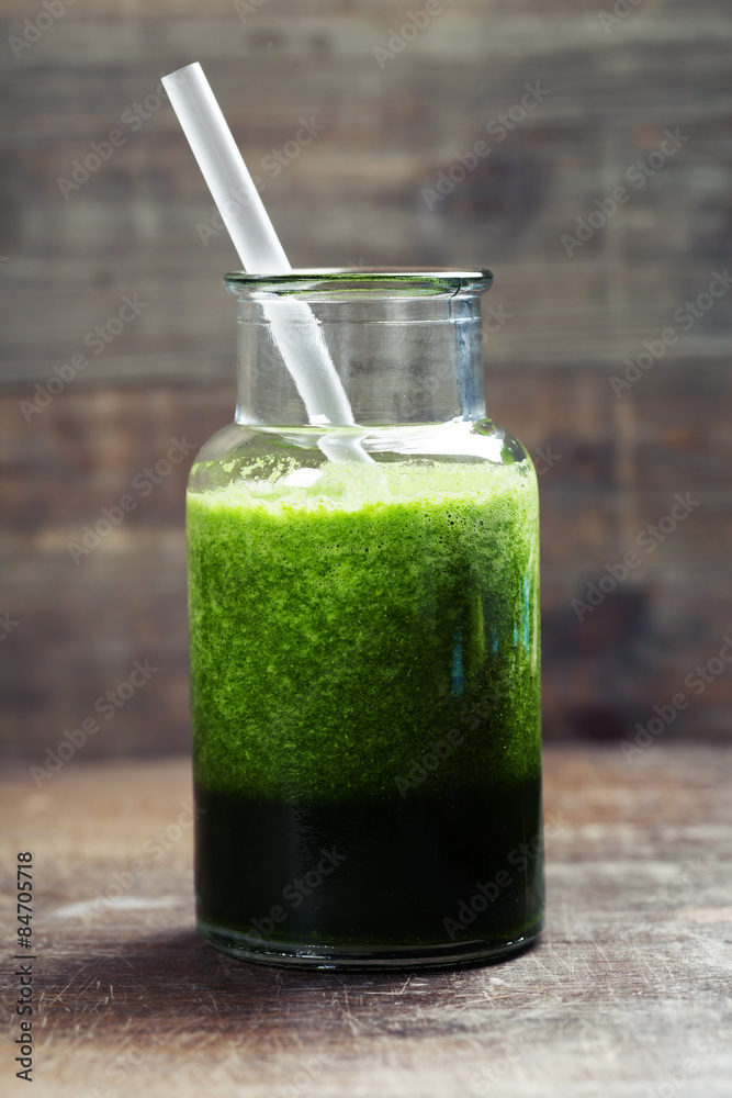 Fresh organic green smoothie - detox, diet and healthy food conc