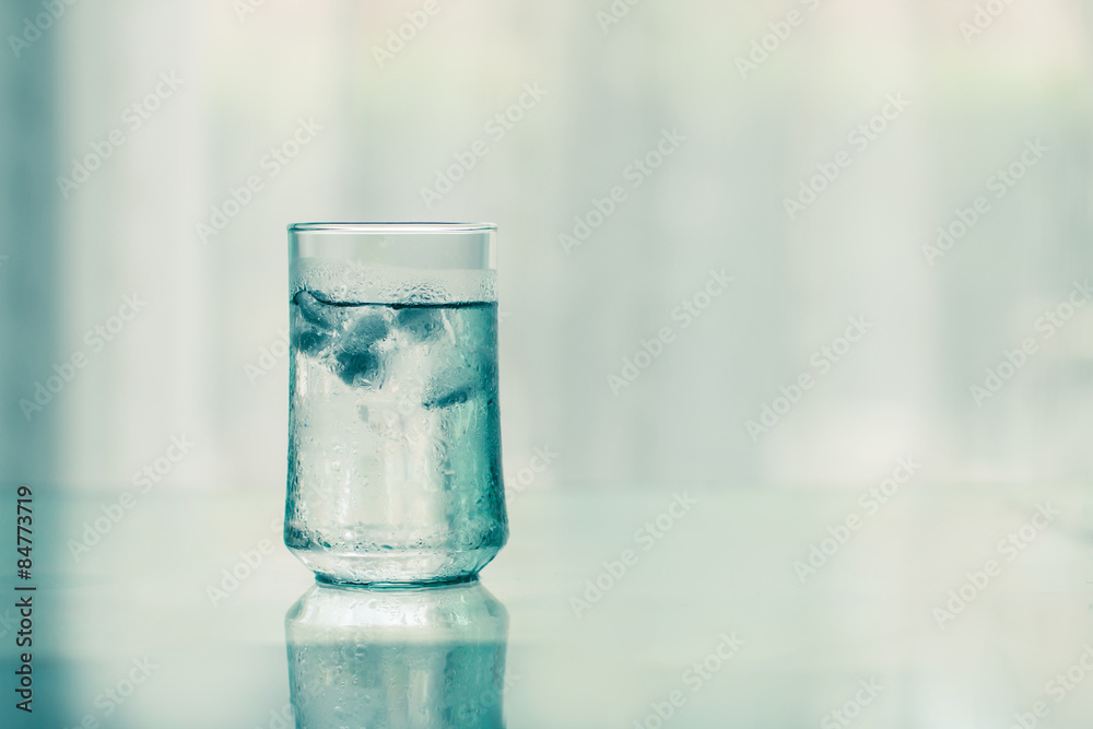 glass of Cool fresh drink with ice cube on the  table