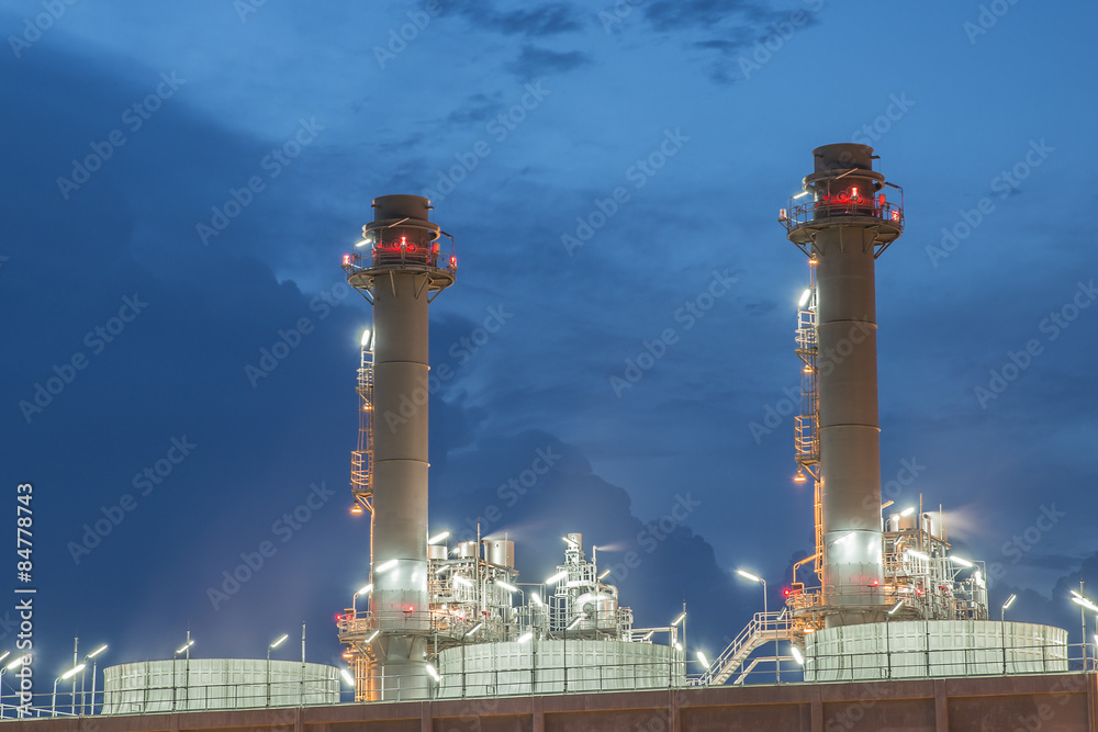 Smokestack in power plant at night